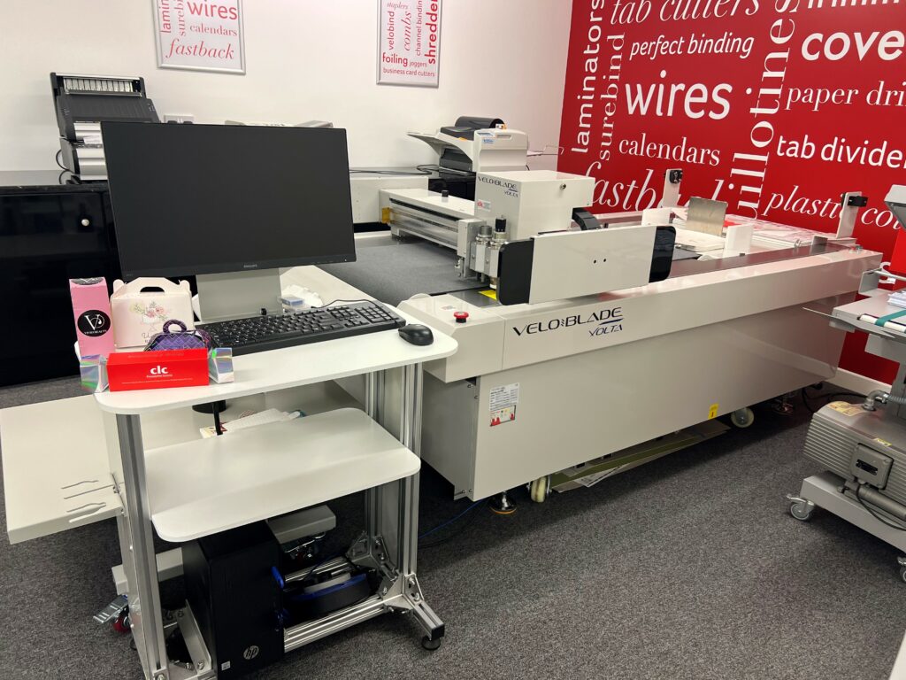 CLC | A room equipped with a computer, printer, and the Veloblade Volta 69+ Digital Die Cutting Machine (Copy).